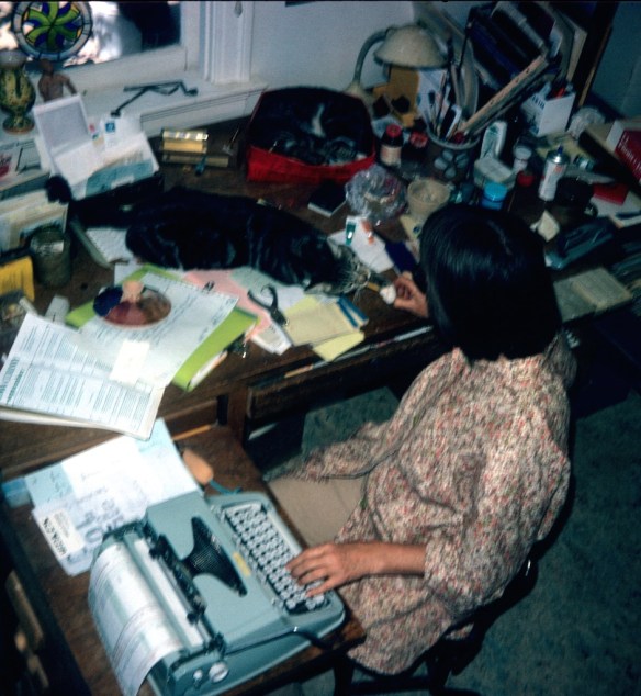 Mom with cats on desk