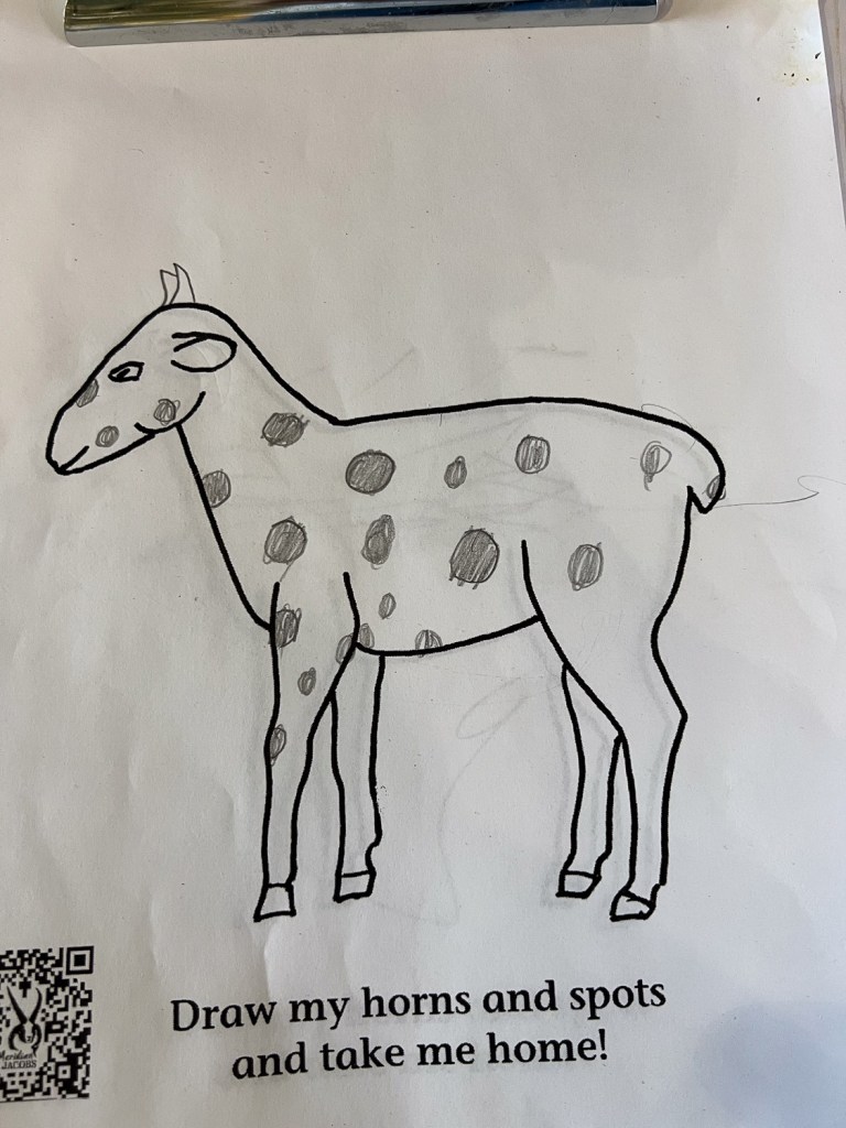 Outline of sheep with spots and horns drawn in using a pencil.