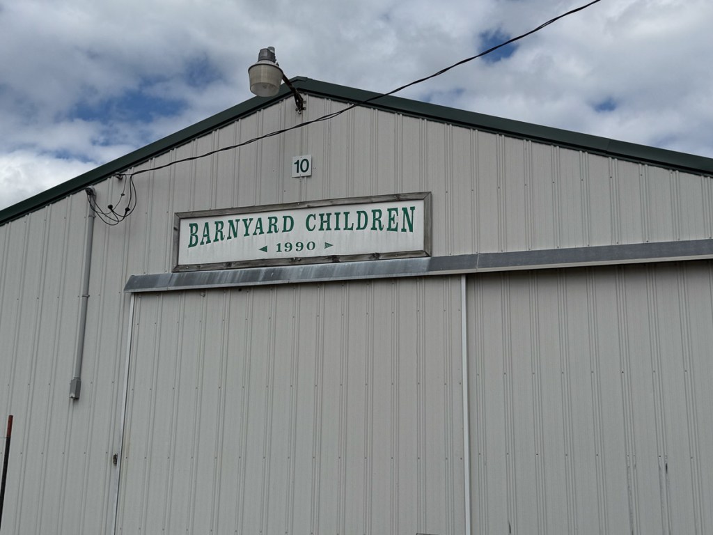 Front of barn with sign that says Barnyard Children.
