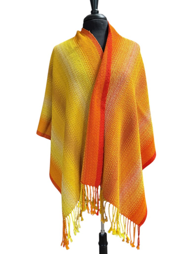 Shawl woven in orange and yellow yarn.