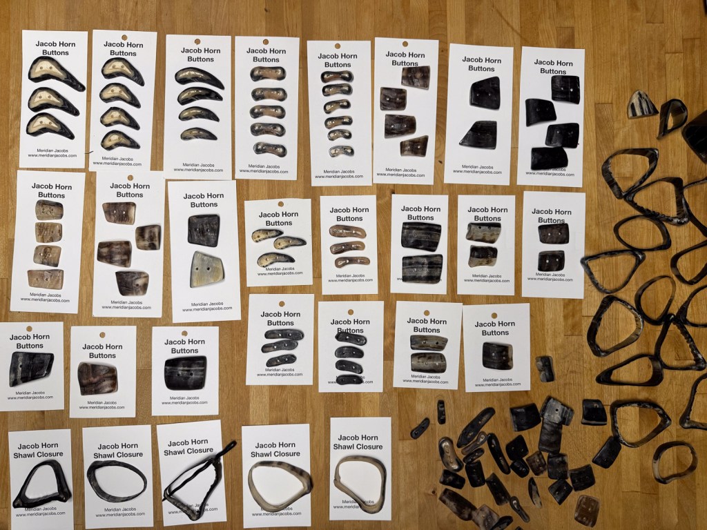 Several rows of cards that hold buttons made of sheep horns.