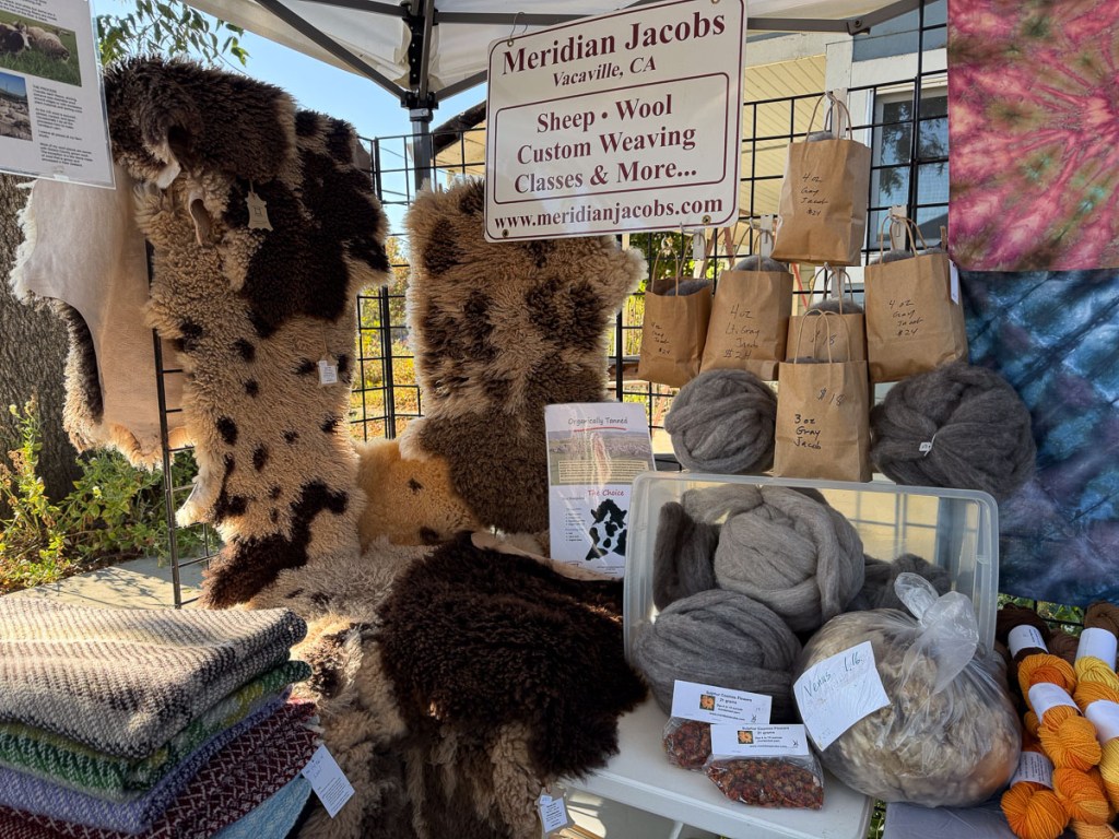 Lambskins, yarn and other products in the Meridian Jacobs booth.